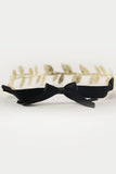 Eve Legtyes in Black and Gold